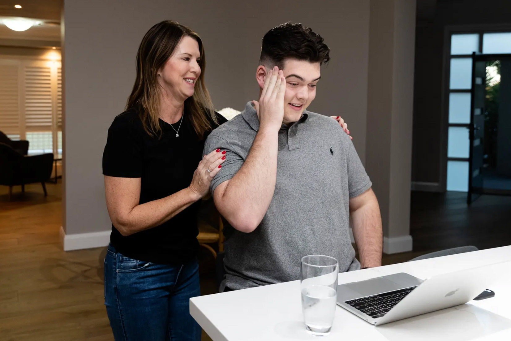 Patrician Brothers student Flynn Broom, with his mother, Katie Broom, gets his HSC results on Friday morning
