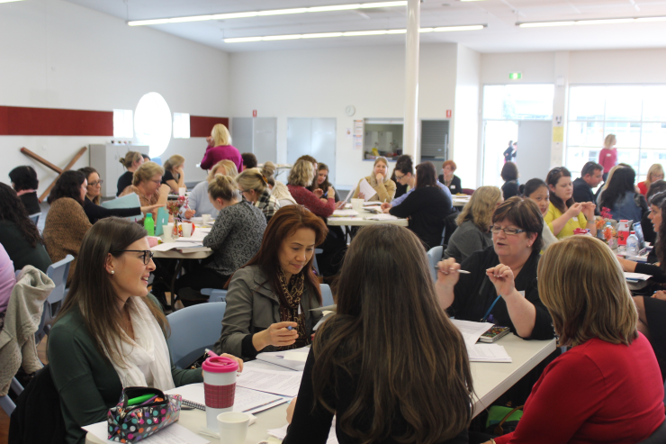 Reading Recovery teachers discussing the day. Reading Recovery teachers discussing the day.