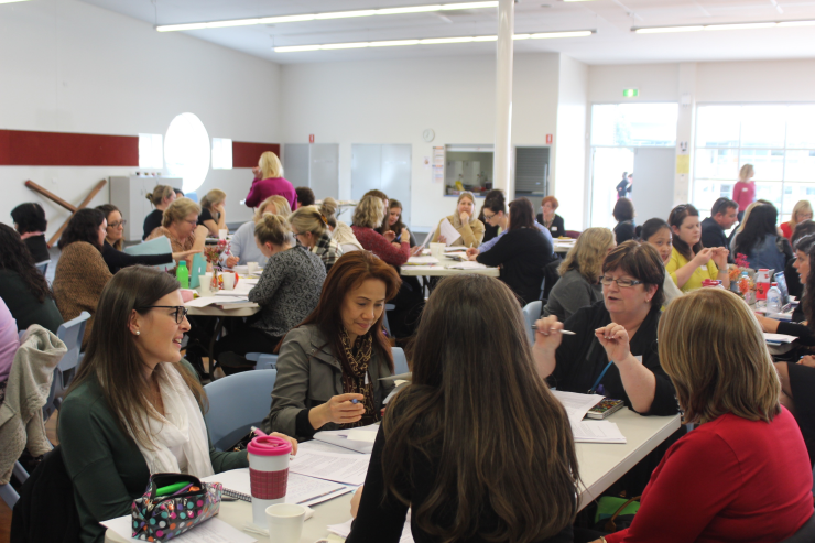 Reading Recovery teachers discussing the day. 